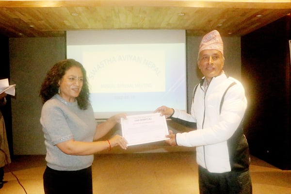 Distributing Certificate of Appreciation to Nabina Shrestha Pradhan